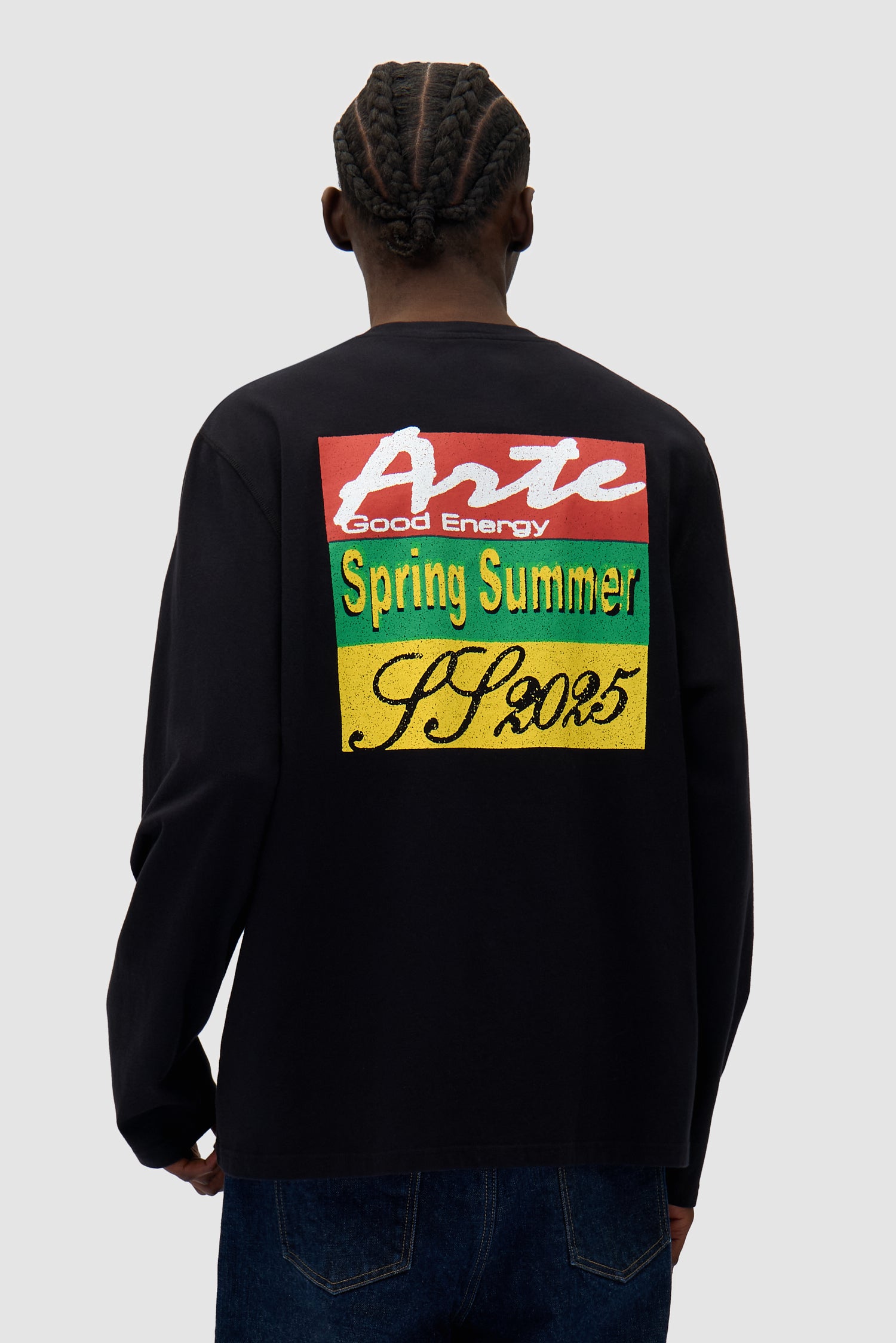 Color Print Longsleeve in Black worn by a model, half-body back view