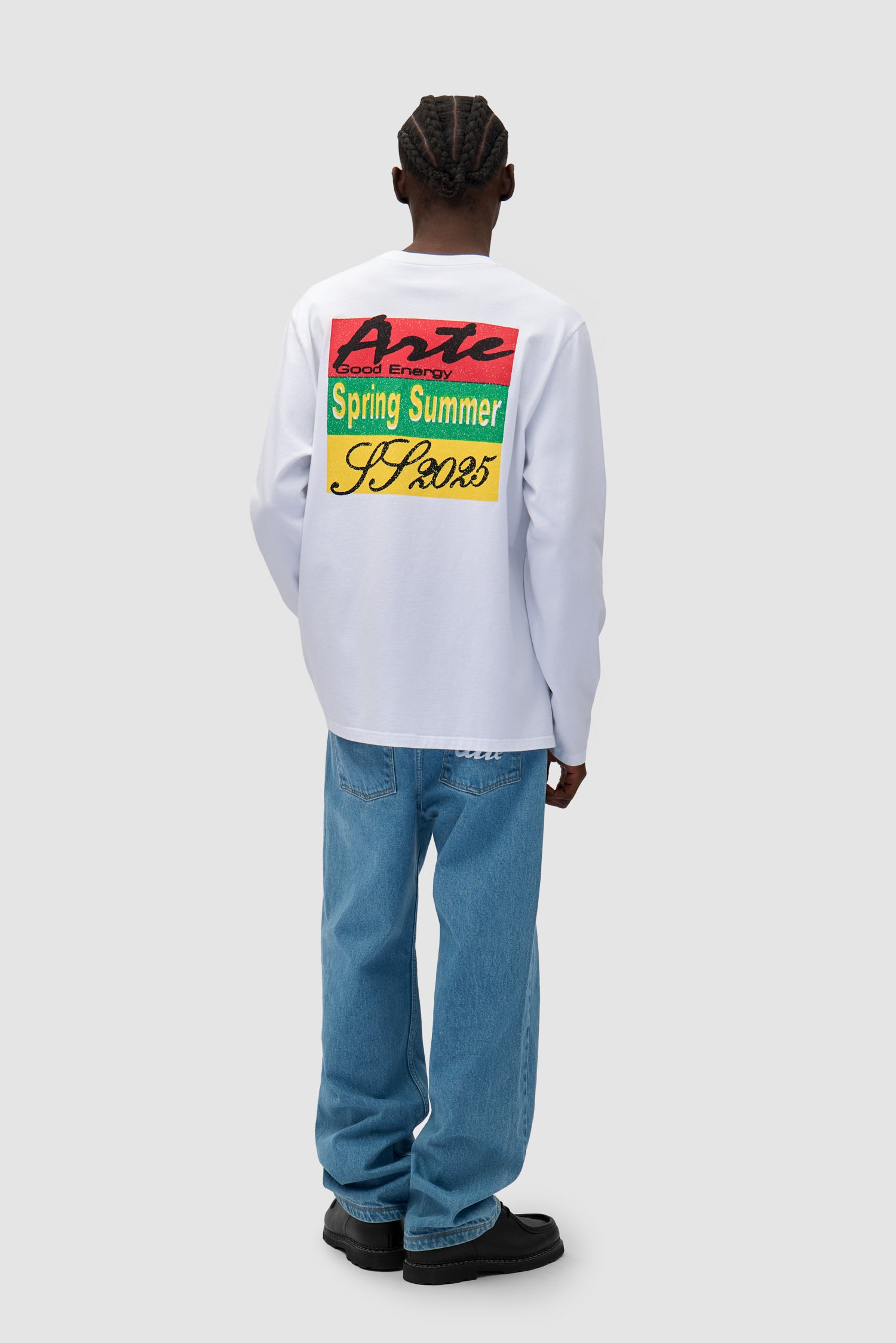 Color Print Longsleeve in White worn by a model, full-body back view