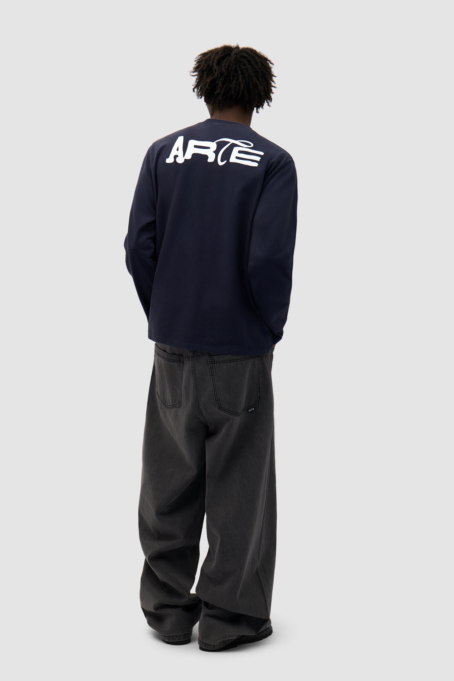 Good Energy Longsleeve in Navy worn by a model, full-body front view