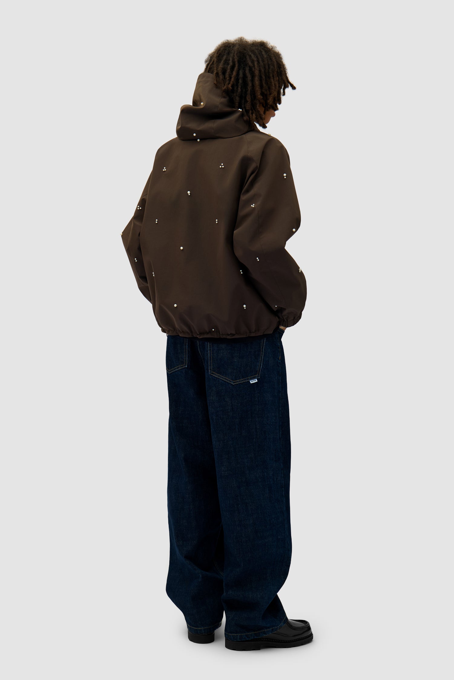 Jacket Beads Jacket in Brown worn by a model, full-body back view