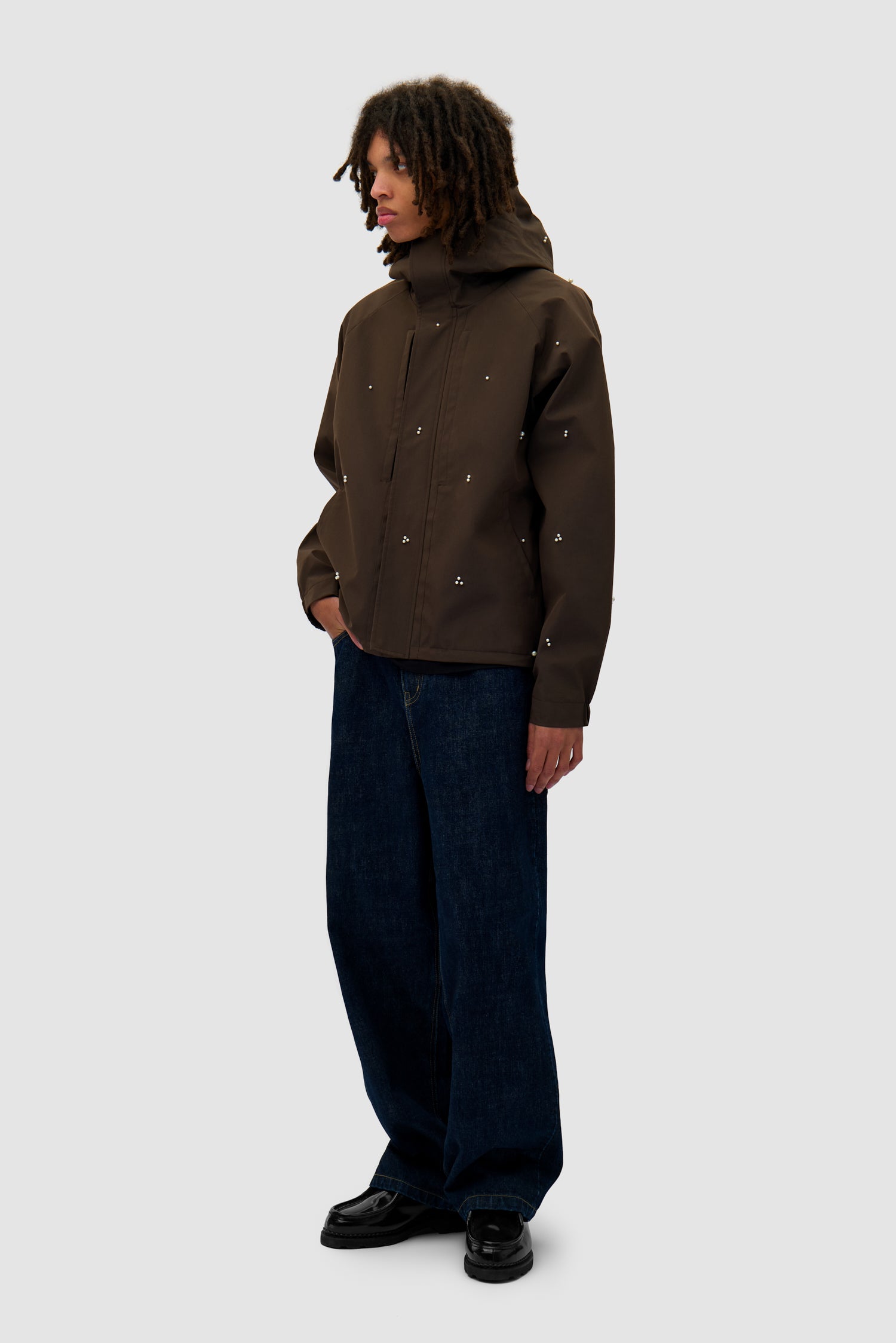 Jacket Beads Jacket in Brown worn by a model, full-body side view