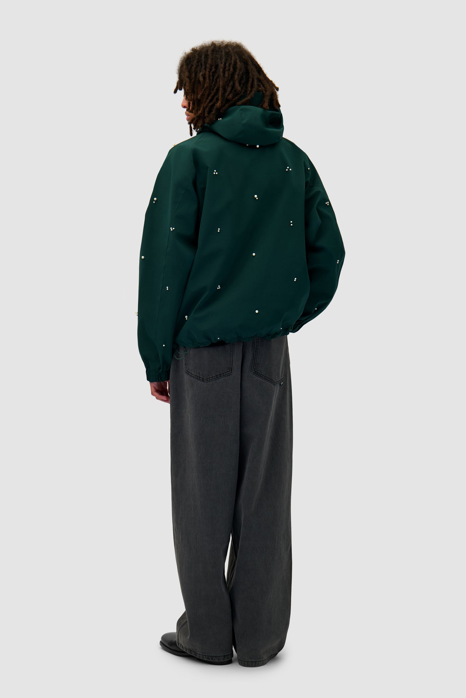 Jacket Beads Jacket in Green worn by a model, full-body back view
