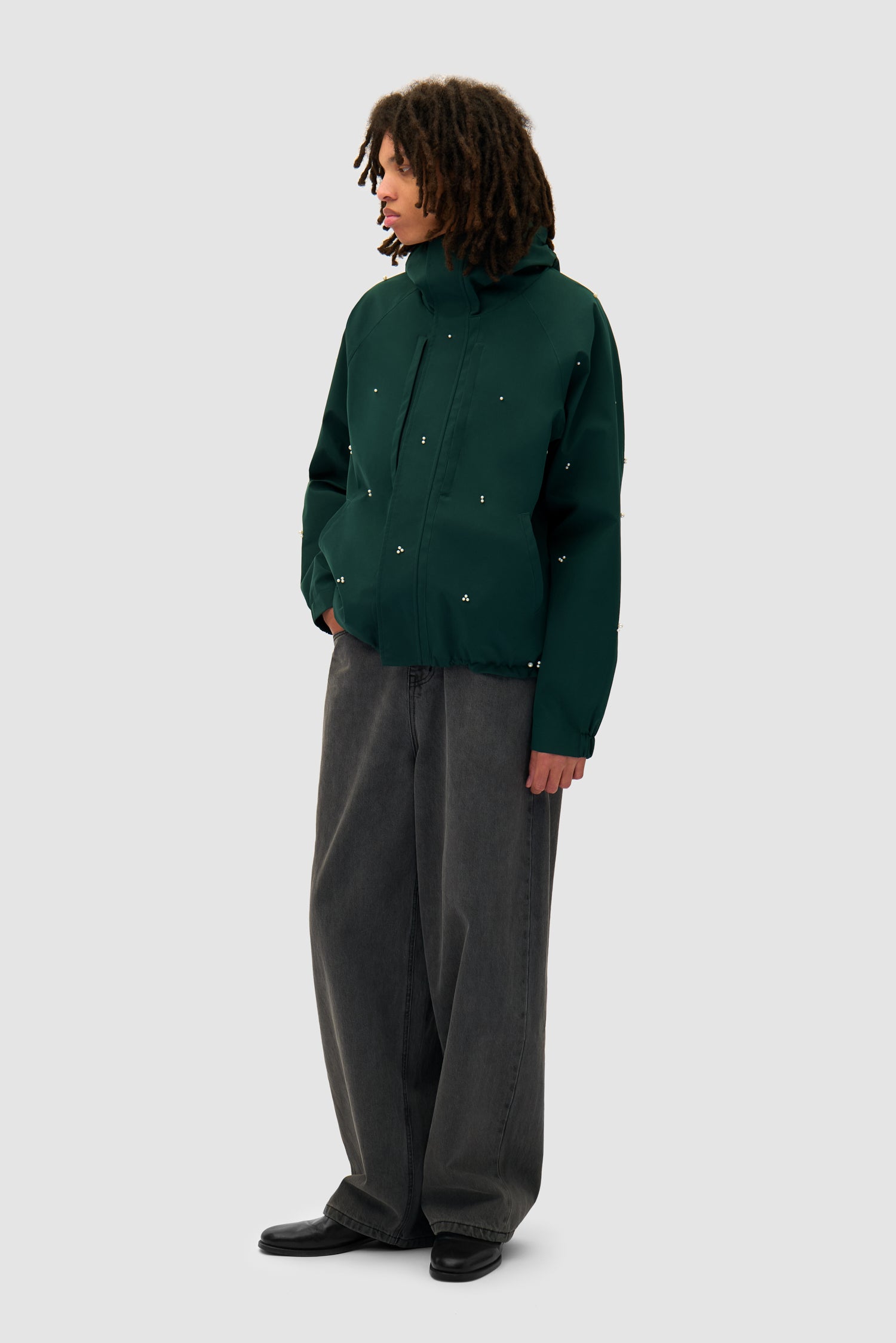 Jacket Beads Jacket in Green worn by a model, full-body side view