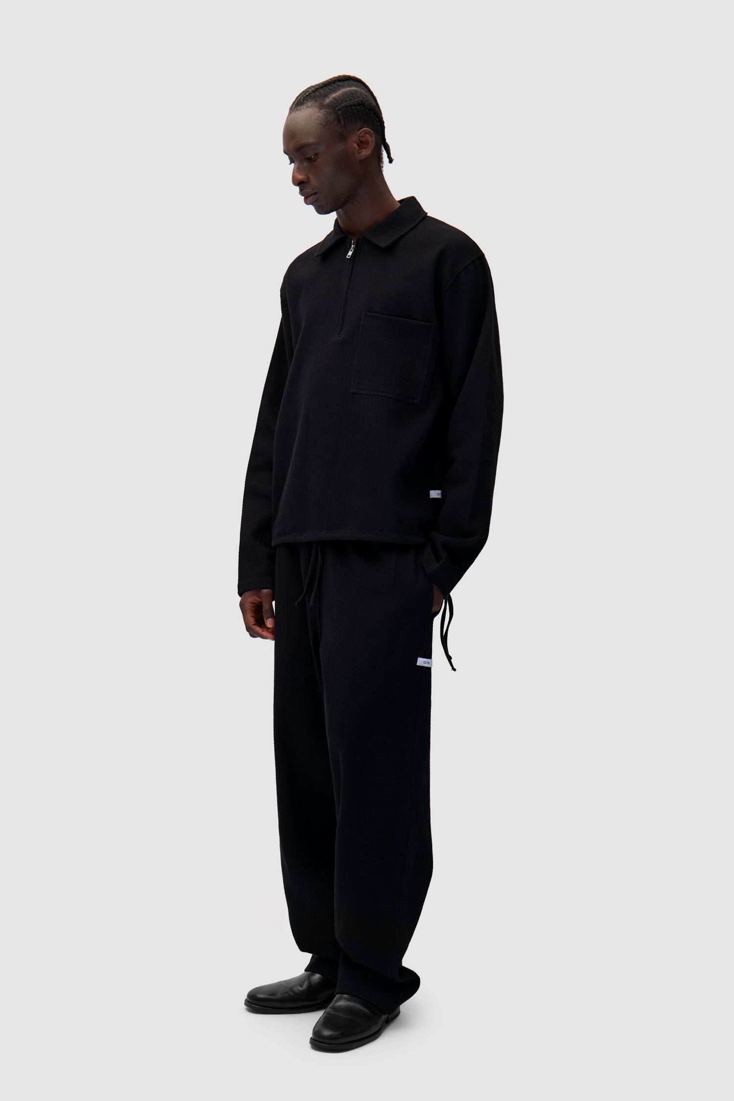 Label Pants in Black worn by a model, full-body front view