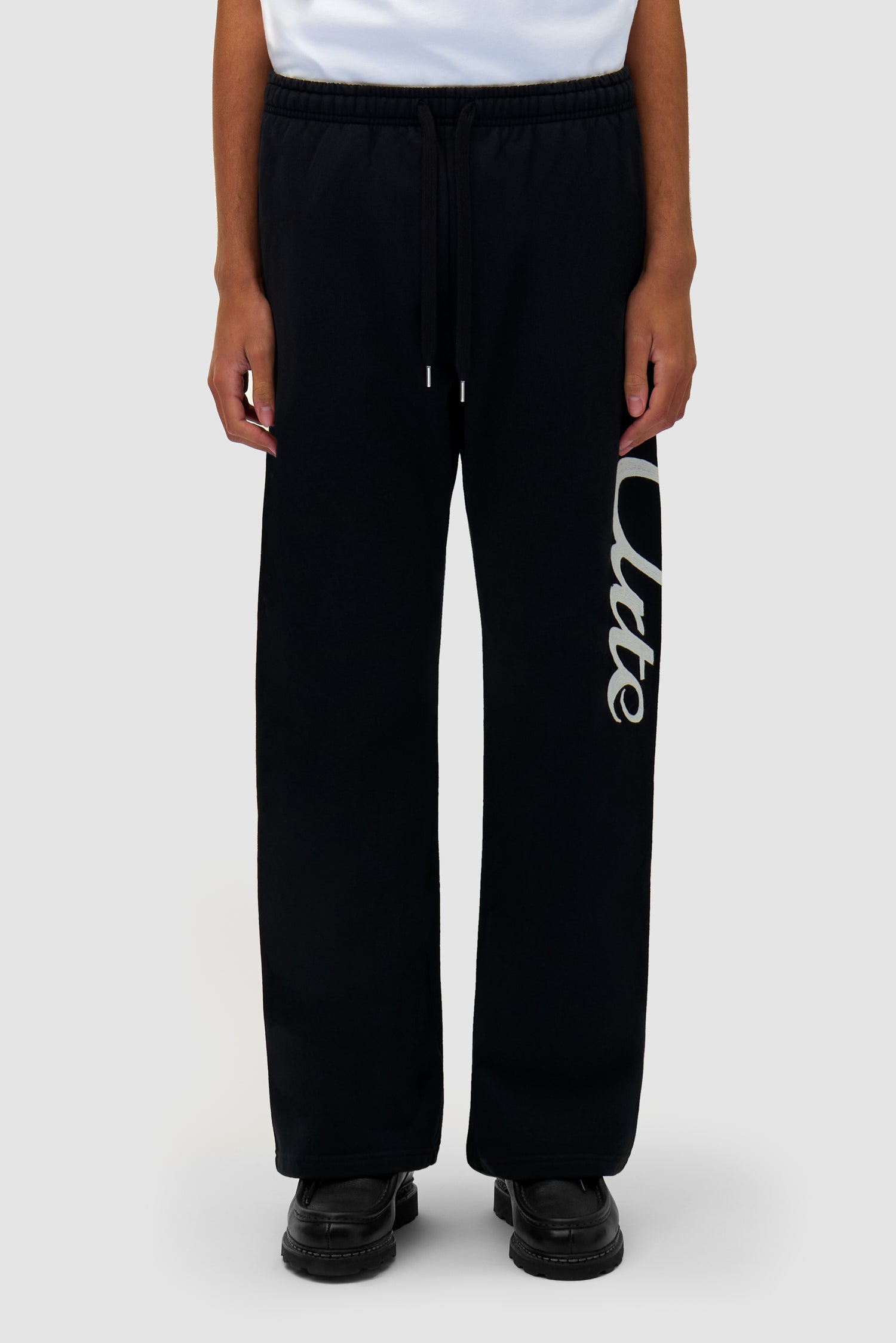 Jogger Pants in Black worn by a model, half-body front view