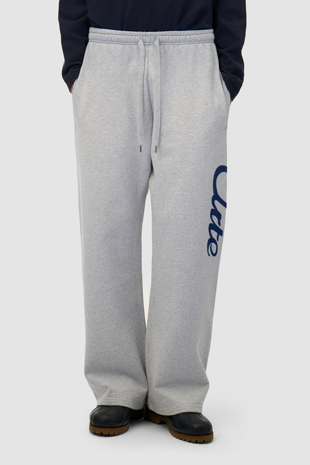 Jogger Pants in Grey worn by a model, half-body front view