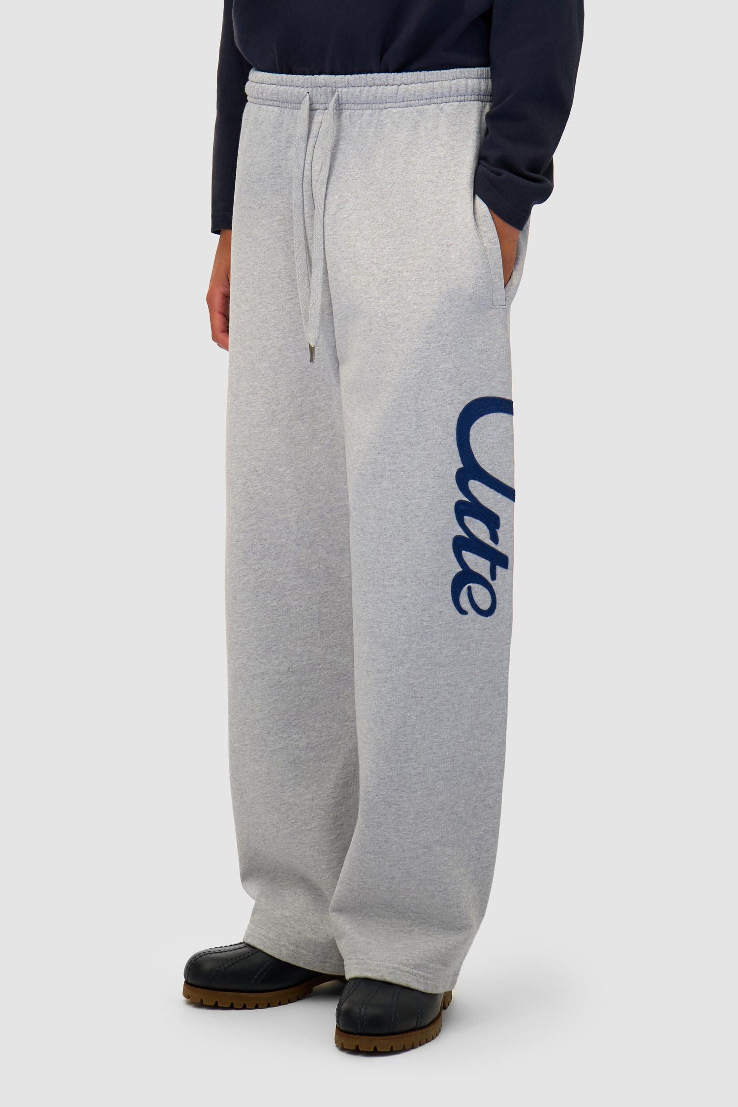 Jogger Pants in Grey worn by a model, half-body side view