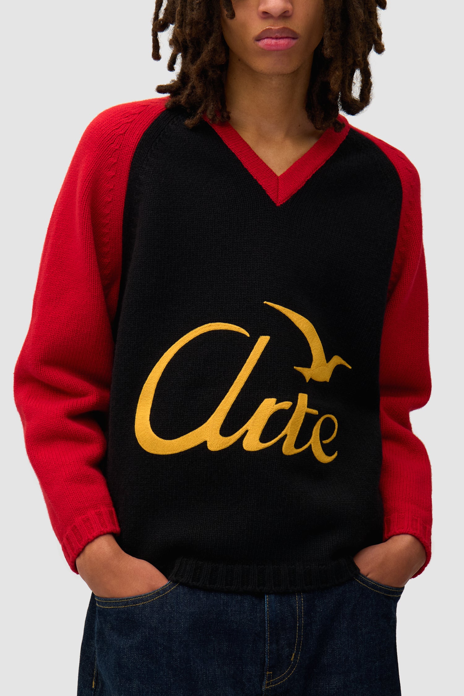 Detail view of Knitted Longsleeve in Black/Red