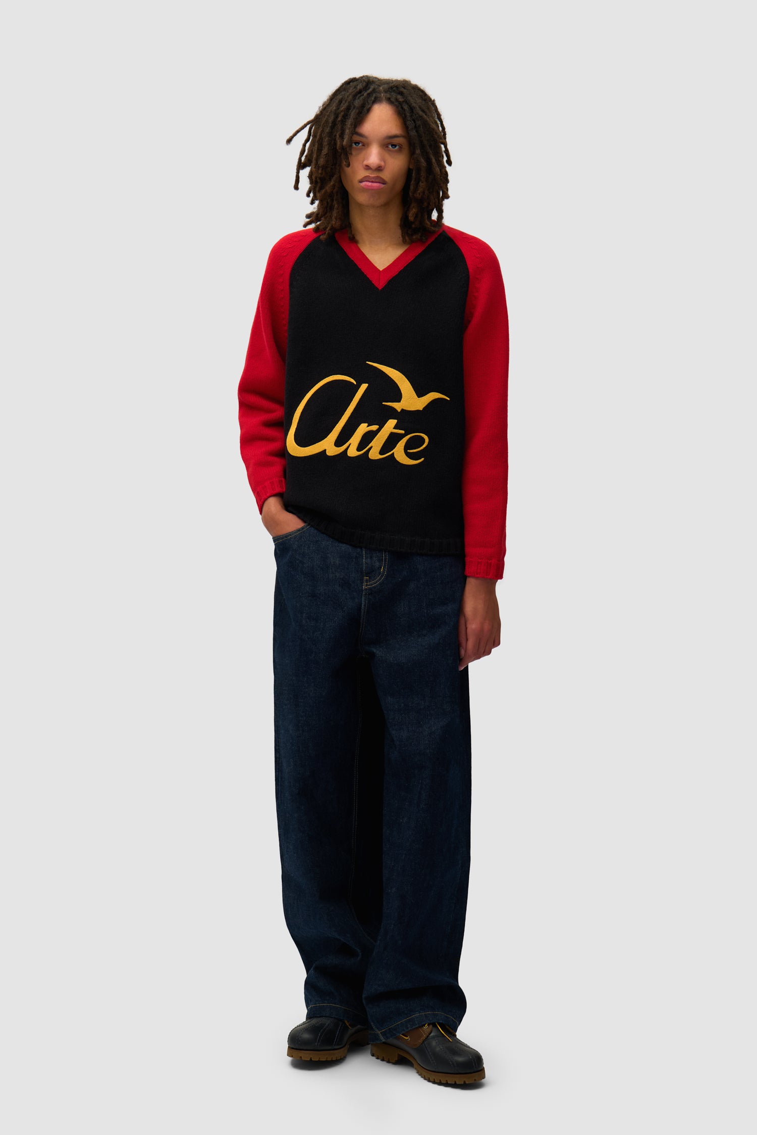 Knitted Longsleeve in Black/Red worn by a model, full-body front view