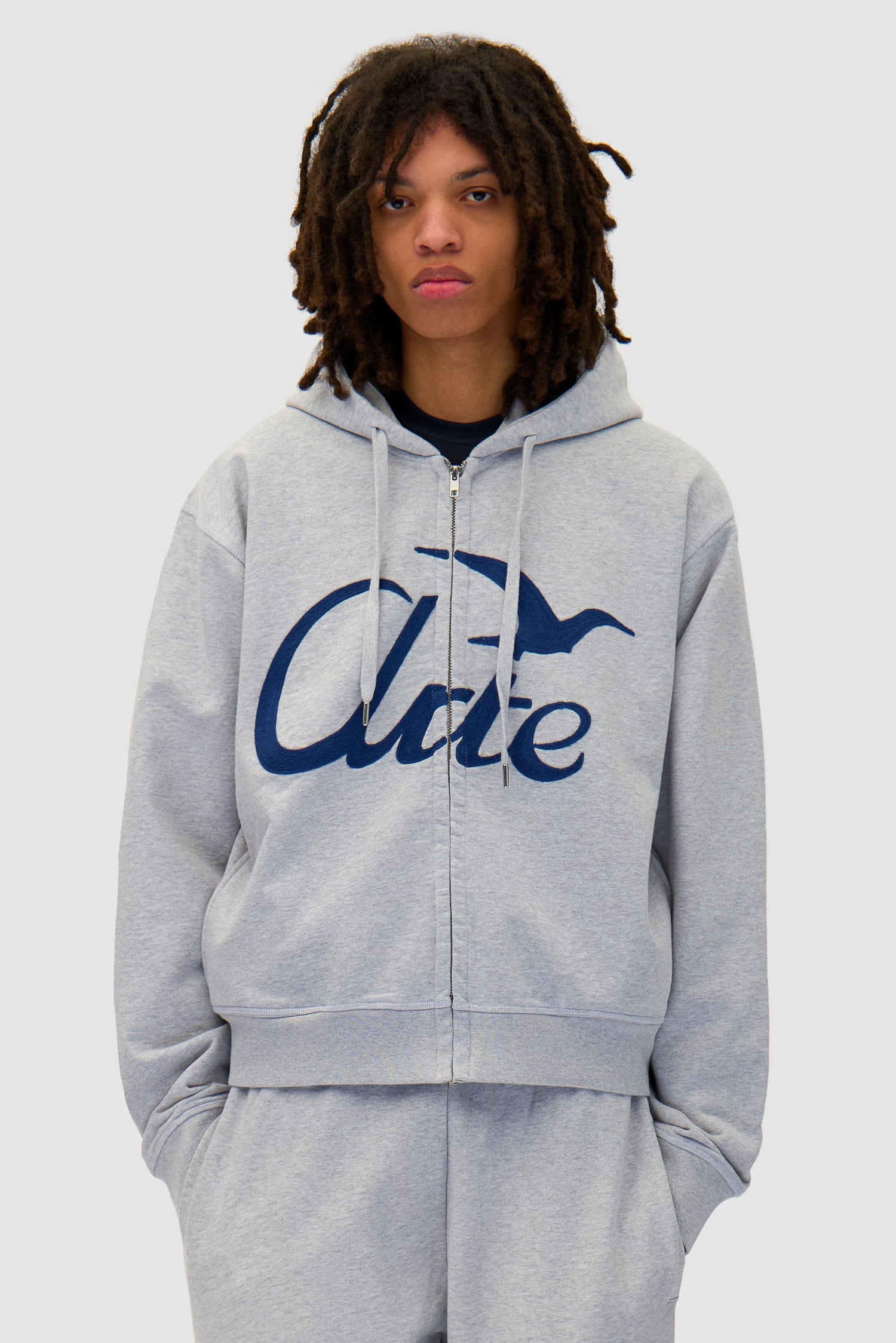 Zipper Hoodie in Grey worn by a model, half-body front view