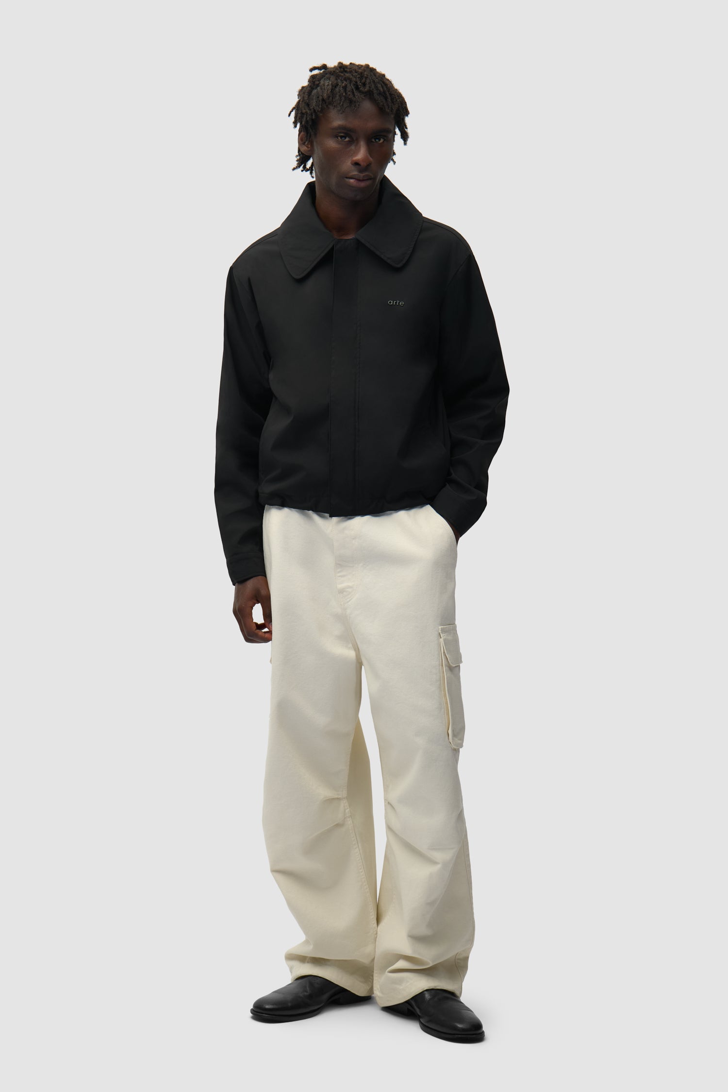 Big Collar Nylon Jacket in Black worn by a model, half-body back view