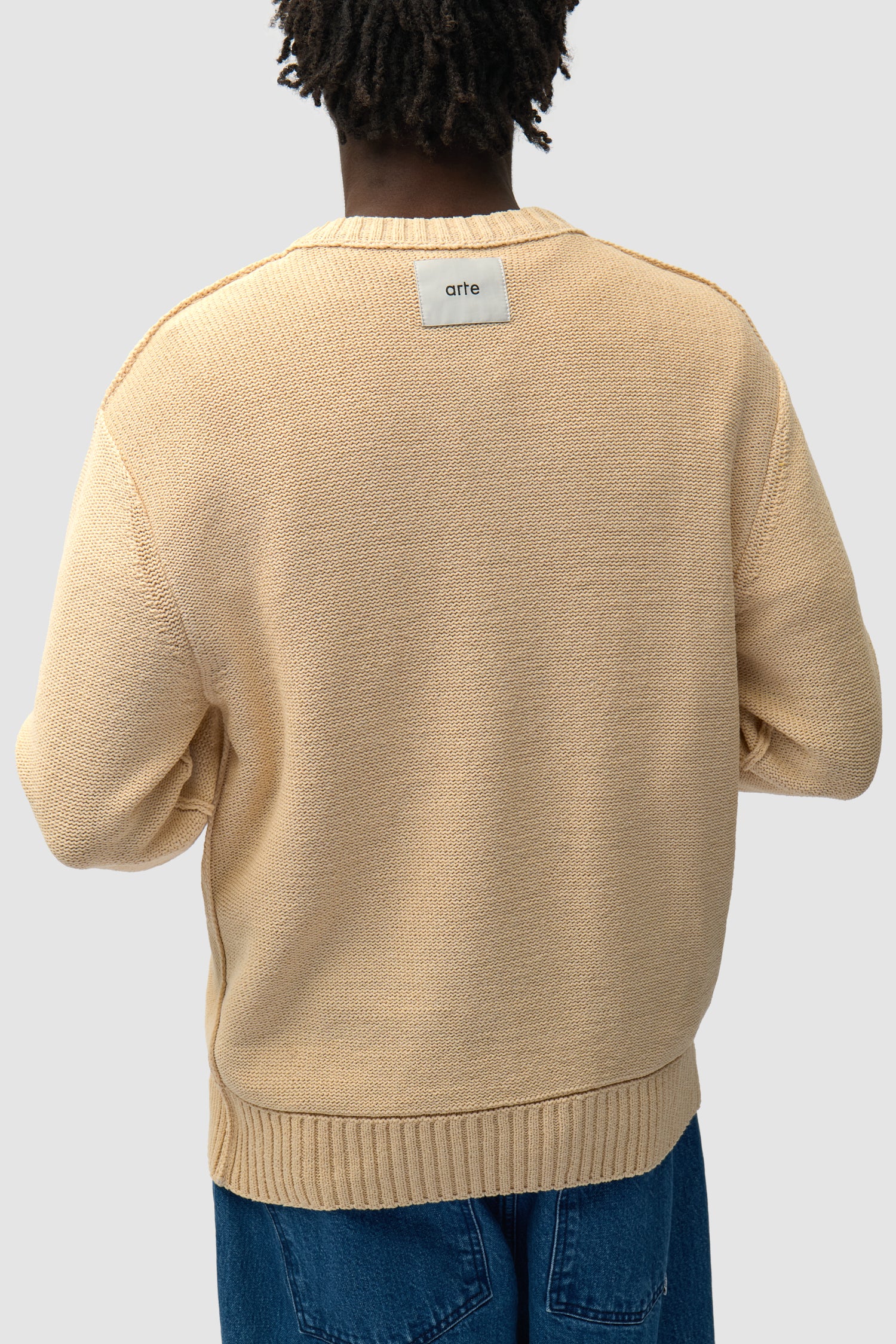 Étiquette réversible en tricot couleur crème, vue de face