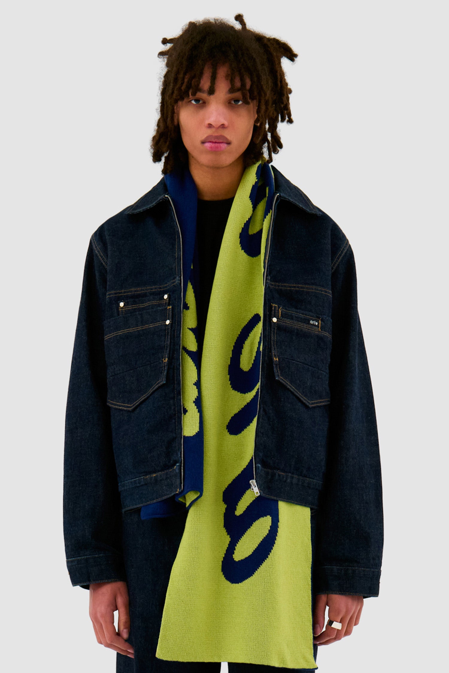 Antwerp Scarf in Navy/Green worn by a model, half-body front view