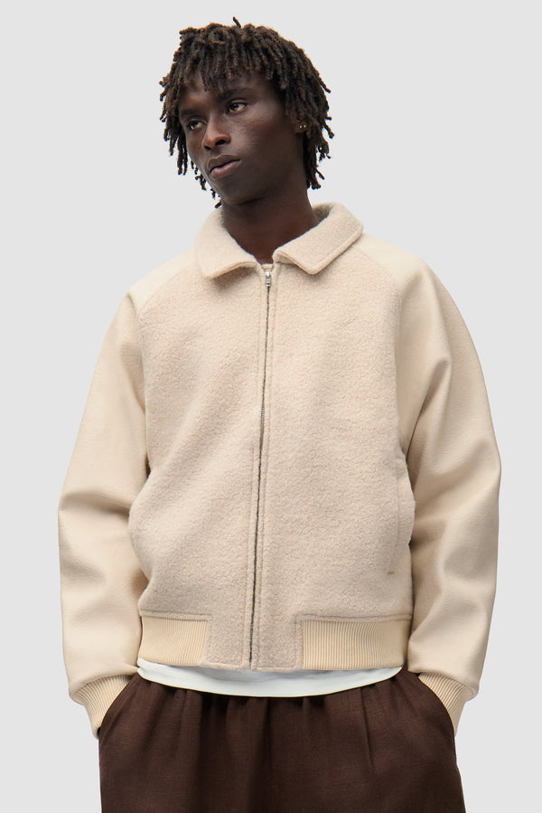 Arte for adidas Varsity Jacket - Cream worn by a model, half-body front view