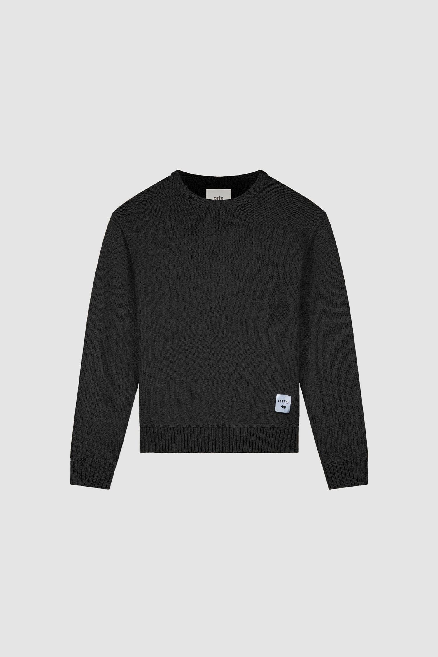 Étiquette réversible en tricot noir, vue de face