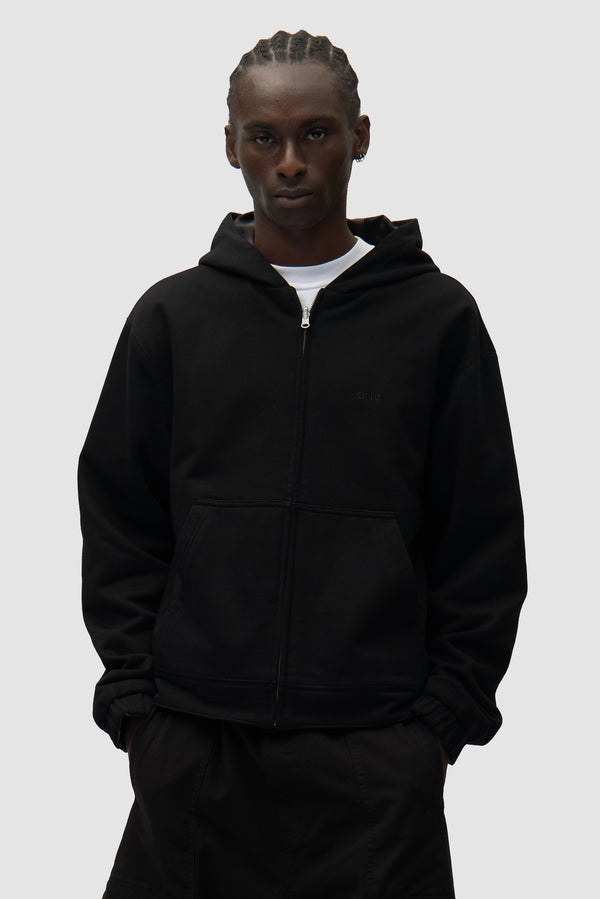 Reversible Fleece Jacket in Black worn by a model, full-body back view