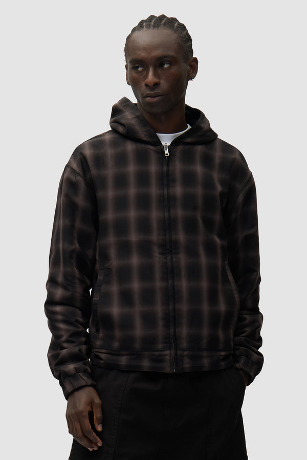 Reversible Fleece Jacket in Black worn by a model, half-body side view
