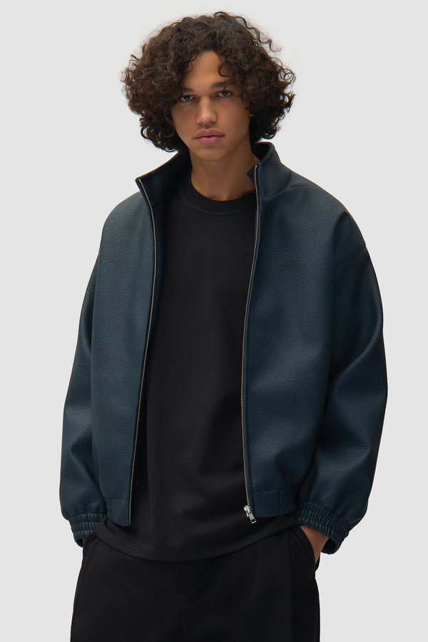 Arte for adidas Faux Leather Jacket in Navy worn by a model, half-body back view