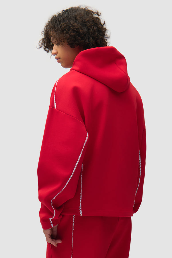 Arte for adidas Z.N.E. Jacket in Better Scarlet/White worn by a model, half-body back view