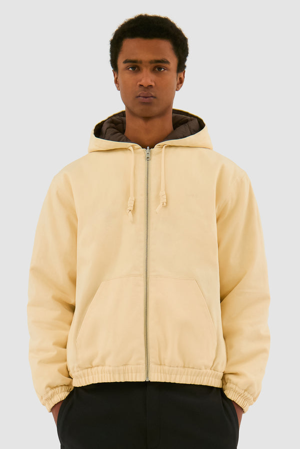 Reversible Hooded Jacket in Cream worn by a model, half-body front view
