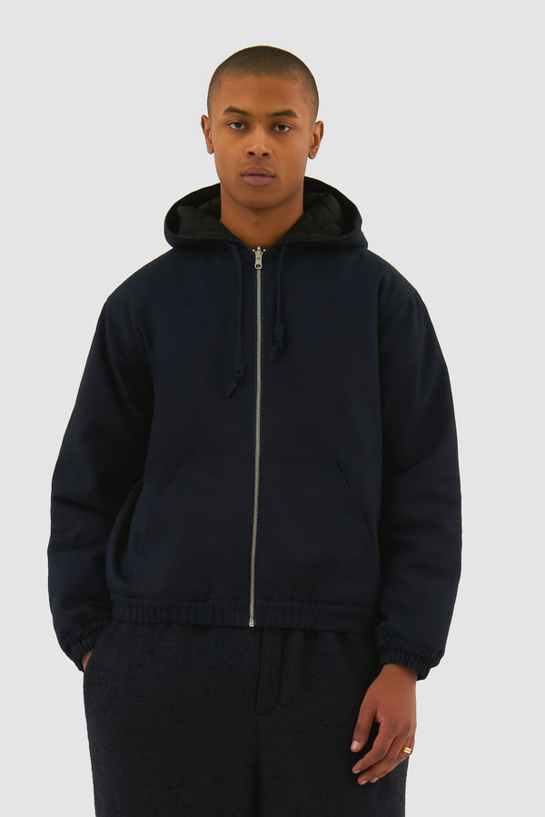 Reversible Hooded Jacket in Navy worn by a model, half-body front view