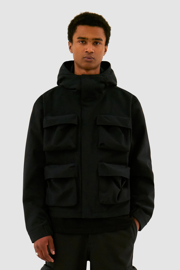 3D Pockets Hooded Nylon Jacket in  Black worn by a model, half-body front view