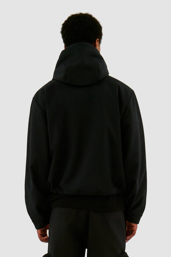 3D Pockets Hooded Nylon Jacket in  Black worn by a model, half-body back view