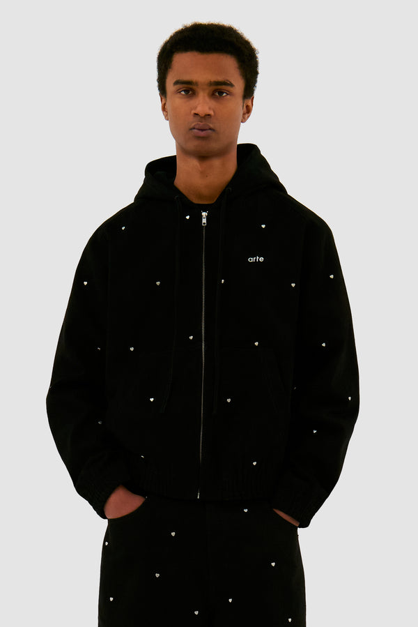 Hooded Metal Hearts Jacket in Black worn by a model, half-body front view
