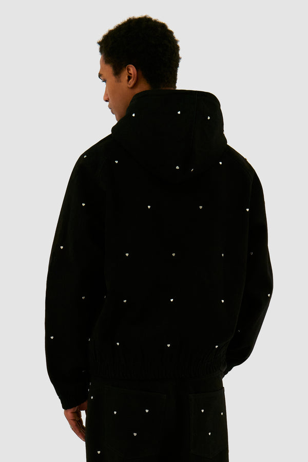 Hooded Metal Hearts Jacket in Black worn by a model, half-body back view