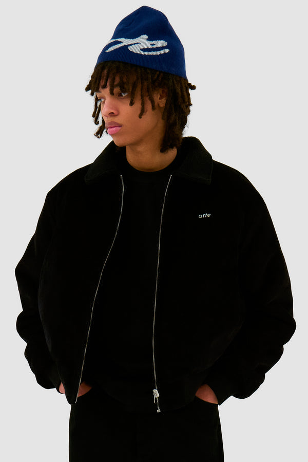 Big Logo Beanie in Navy worn by a model, half-body front view