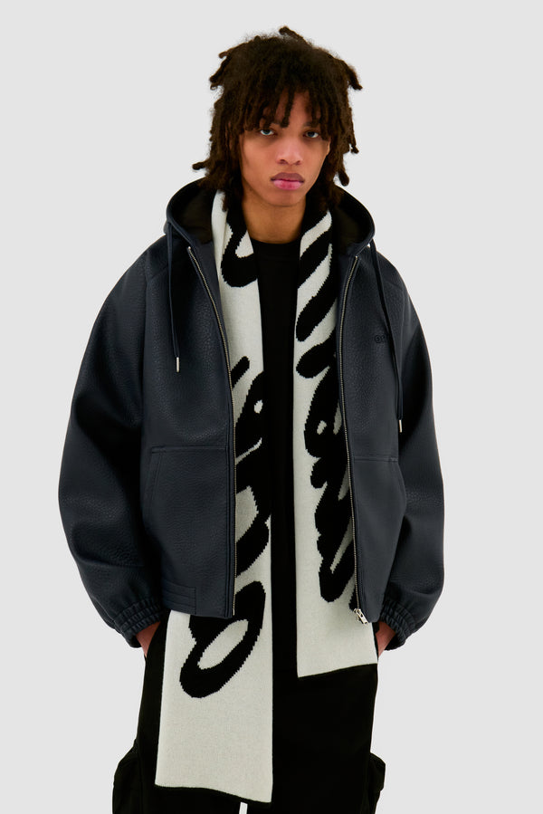 Antwerp Scarf in Black worn by a model, half-body front view