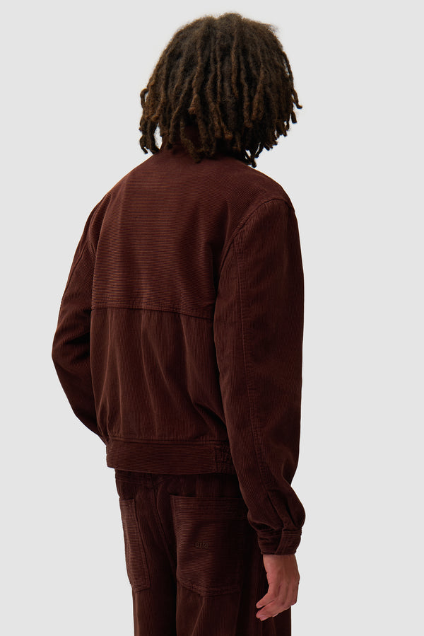 Corduroy Jacket in Brown worn by a model, half-body back view