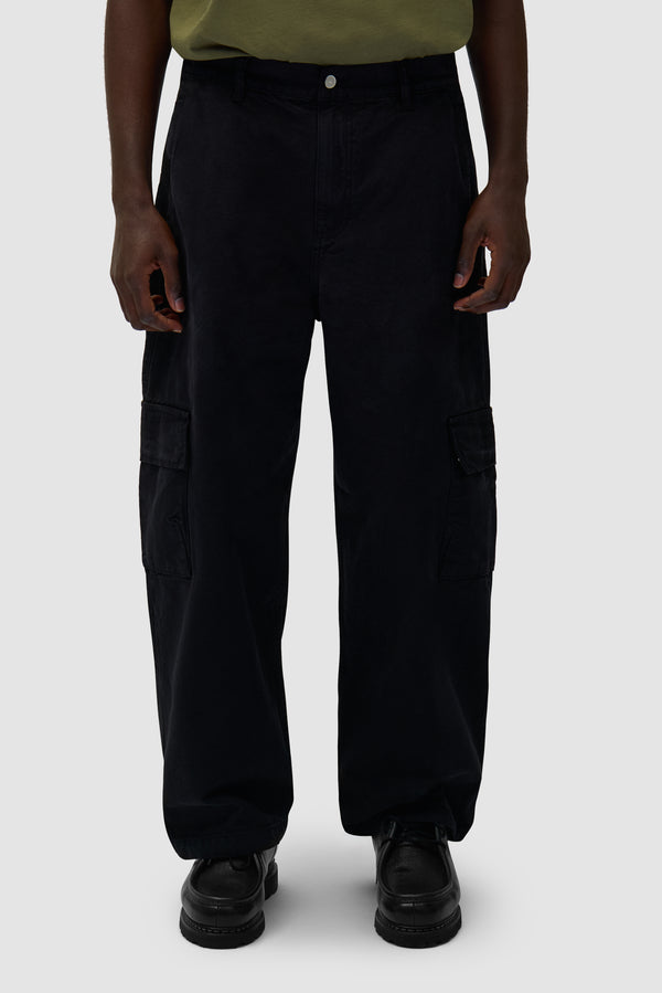 Low Cargo Pants in Black worn by a model, half-body front view