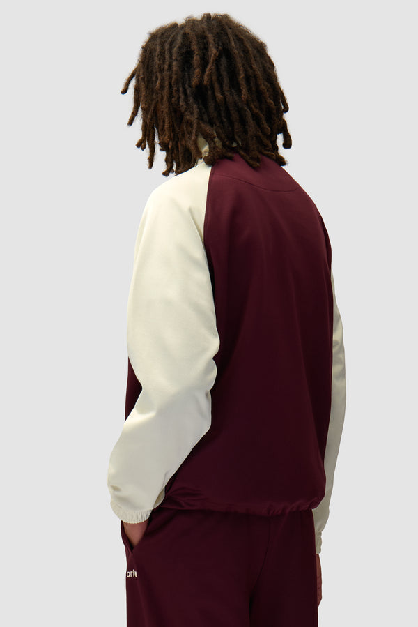 Carded Tracksuit Top in Bordeaux/Cream worn by a model, half-body back view