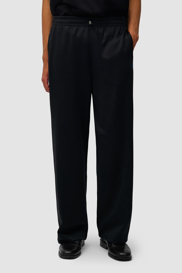 Carded Tracksuit Bottom in Black worn by a model, half-body front view