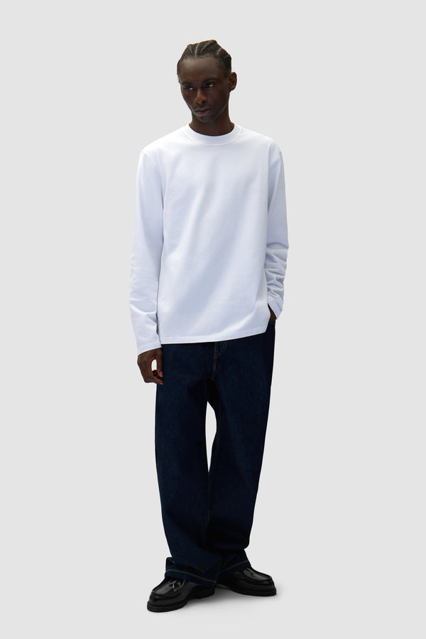 Basic Jeans Pants in Raw Denim worn by a model, full-body front view