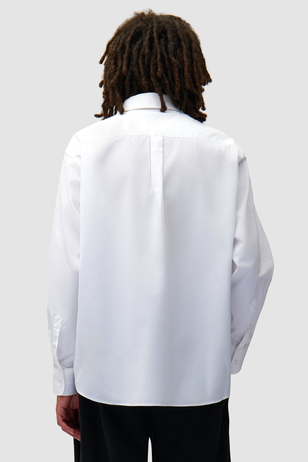 Arte Blocks Shirt in White worn by a model, half-body back view