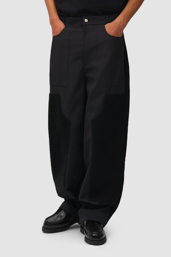 Nylon/Wool Combo Pants in Black worn by a model, half-body front view