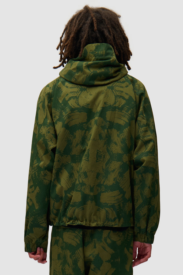 Scratch Technical Jacket in Green worn by a model, half-body back view