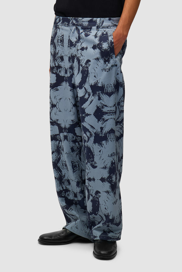 Scratch Technical Pants in Blue worn by a model, half-body side view