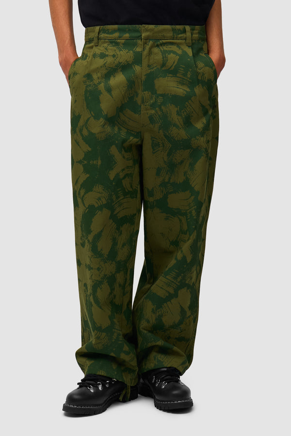 Scratch Technical Pants in Green worn by a model, half-body front view