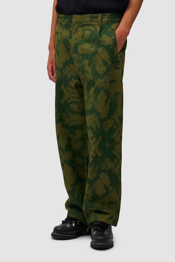 Scratch Technical Pants in Green worn by a model, half-body side view