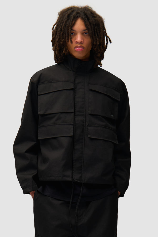 Waxed Ripstop Jacket in Black worn by a model, half-body front view