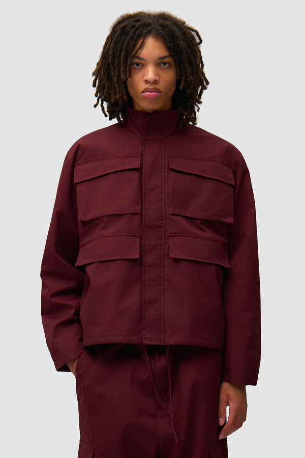 Waxed Ripstop Jacket in Bordeaux worn by a model, half-body front view