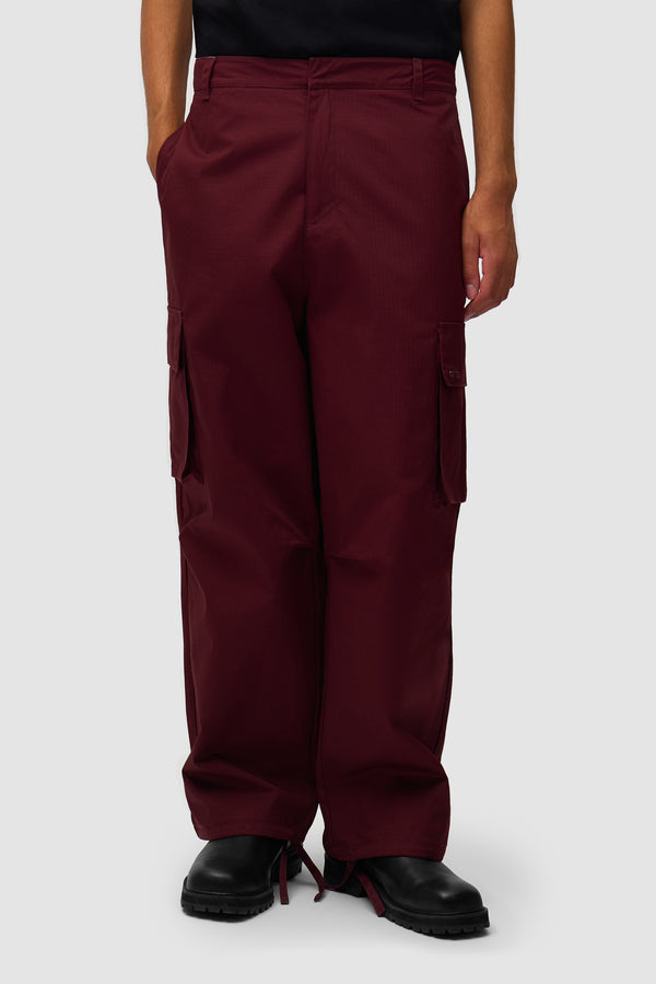 Waxed Ripstop Pants in Bordeaux worn by a model, half-body front view