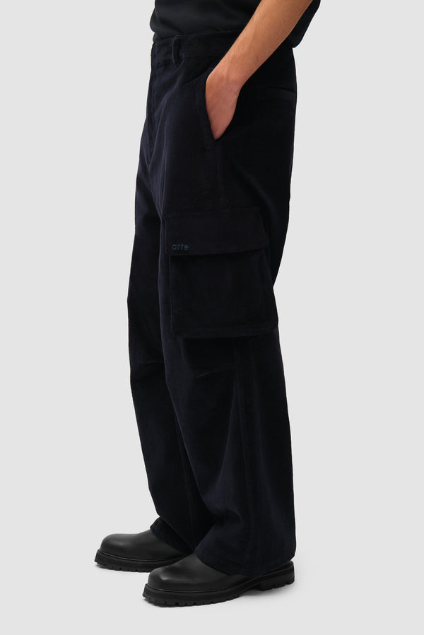 Corduroy Cargo Pants in Navy worn by a model, half-body side view