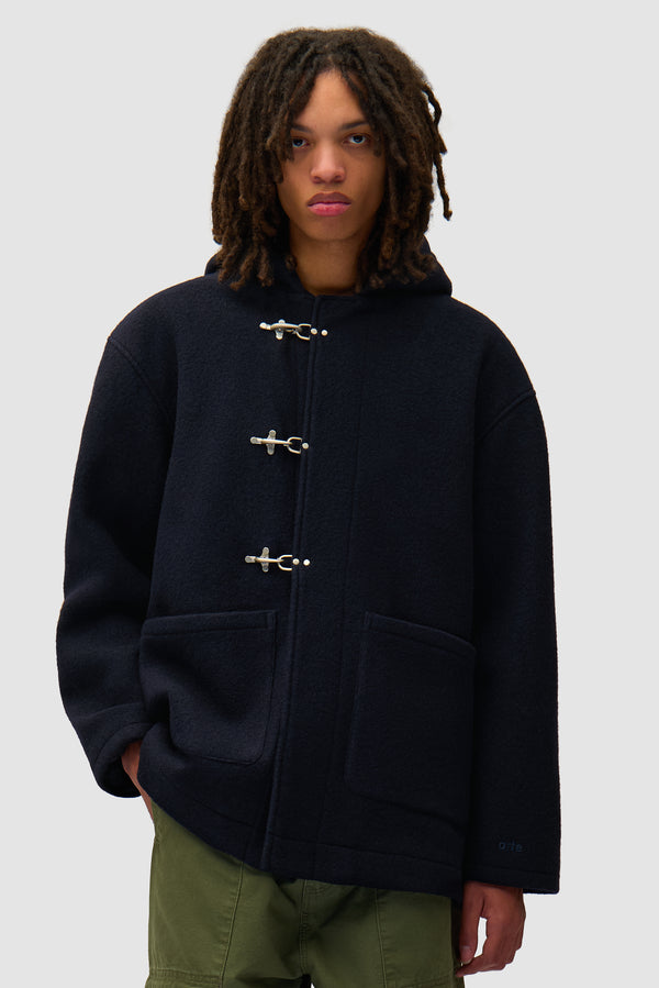 Duffel Coat in Navy worn by a model, half-body front view