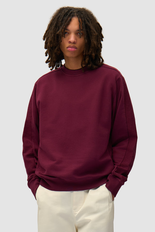 In/Out Crewneck in Bordeaux worn by a model, half-body front view