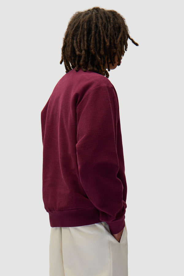 In/Out Crewneck in Bordeaux worn by a model, half-body back view