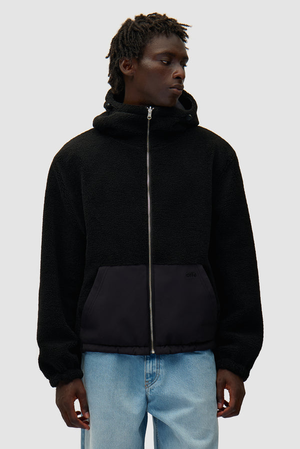 Nylon Technical Jacket in black worn by a model, half-body front view